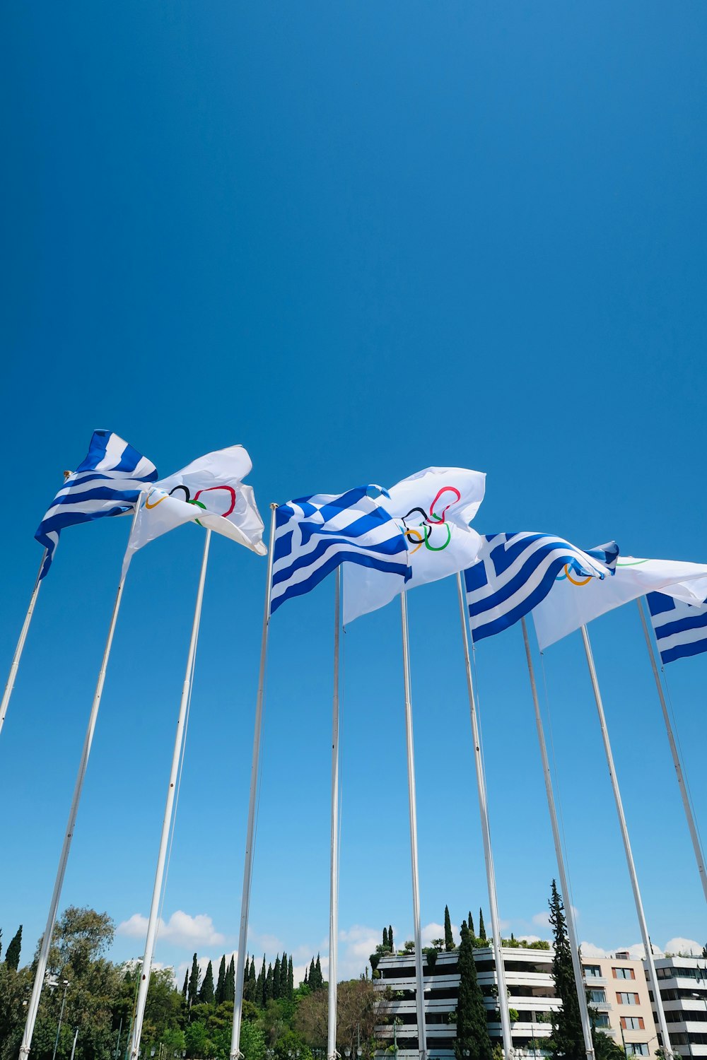 a group of flags flying in the air