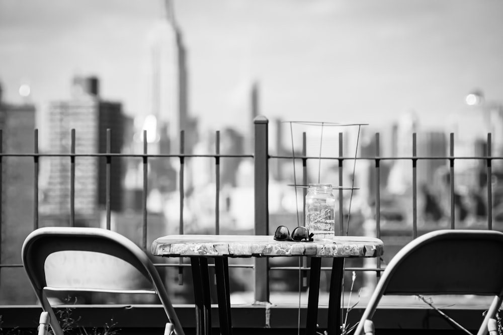 a table and chairs on a balcony