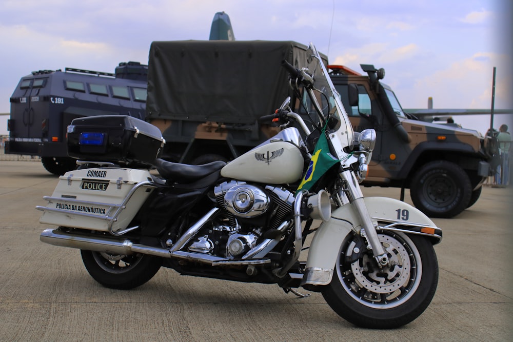 a motorcycle parked in front of a truck