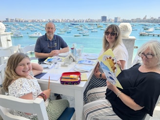 Happy family enjoying the spacious outdoor terrace of their bayn by ora townhome.
