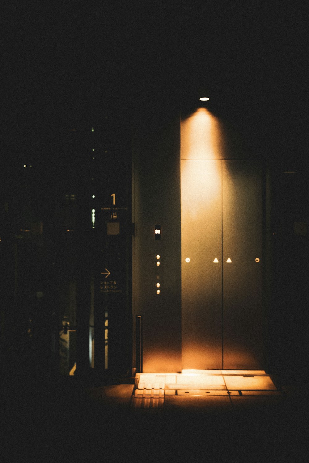a tall pillar with lights at night