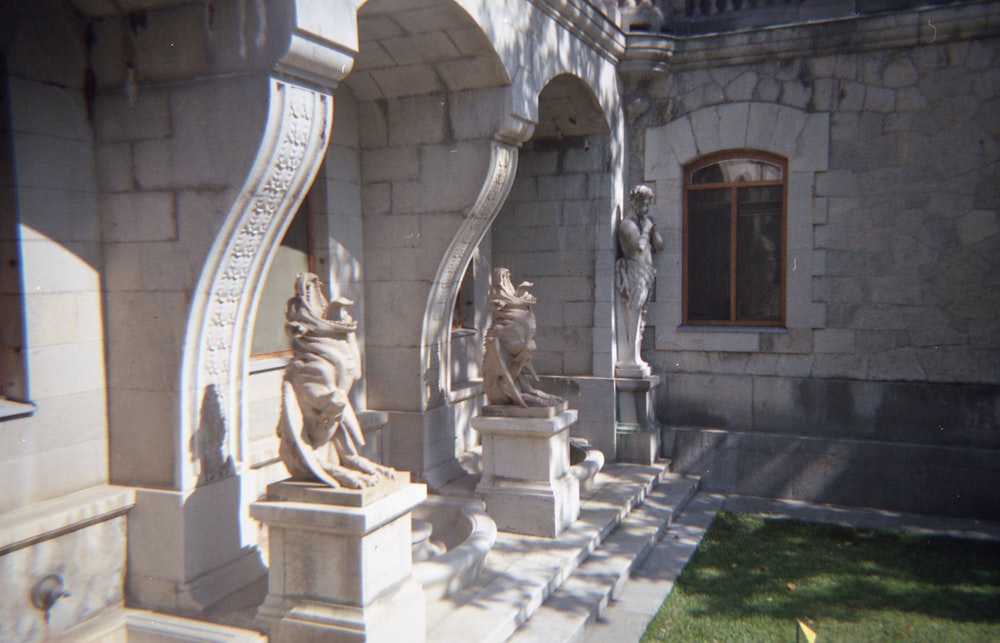 a stone building with statues
