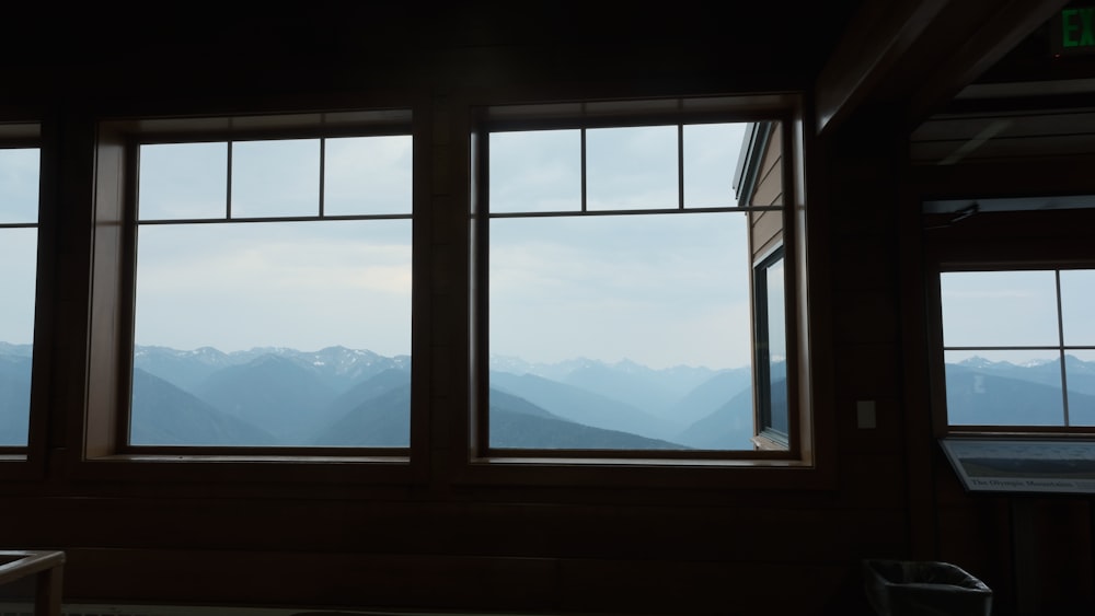 a view of mountains through a window