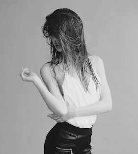 a woman with her hands in her hair