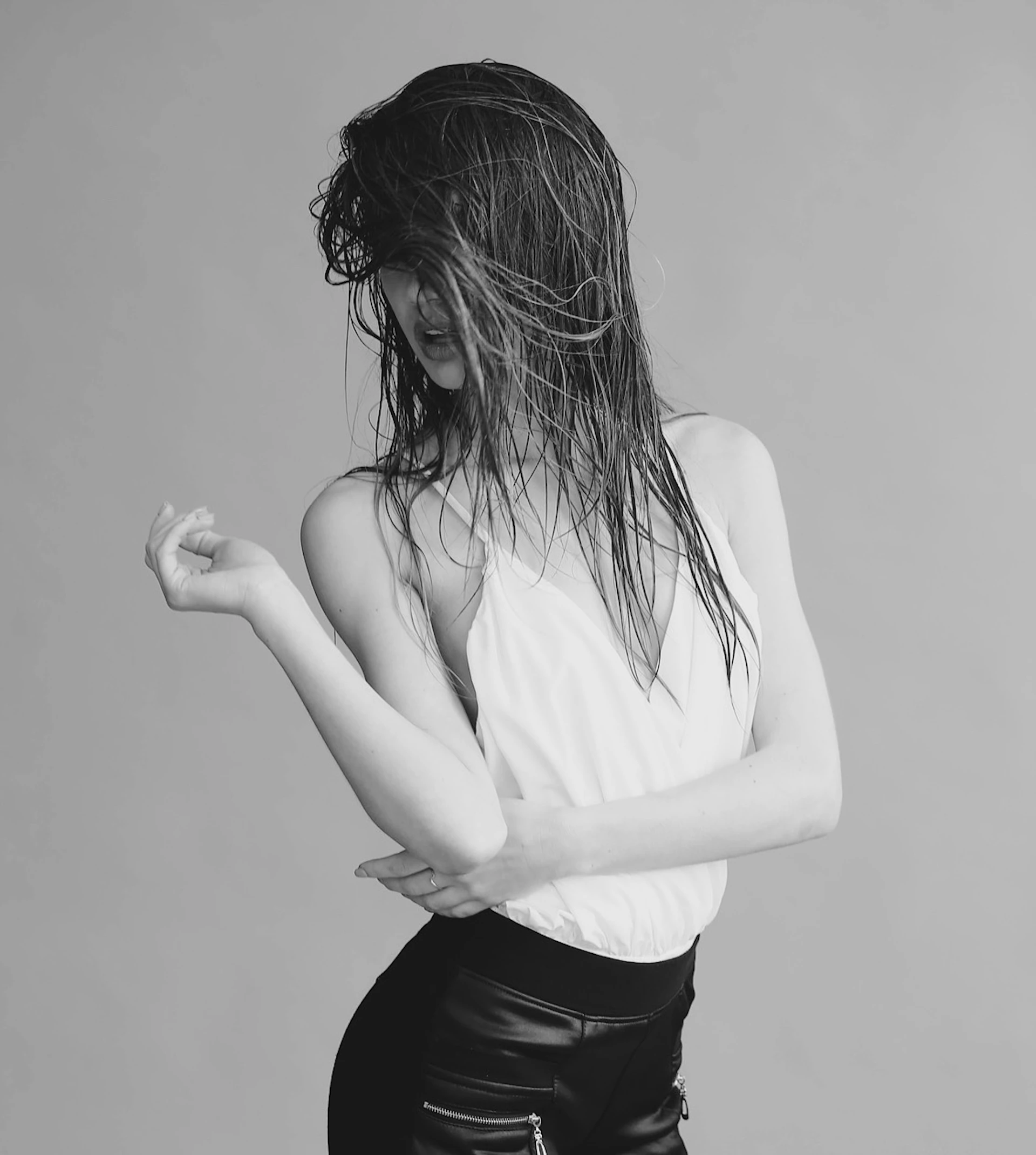 a woman with her hands in her hair