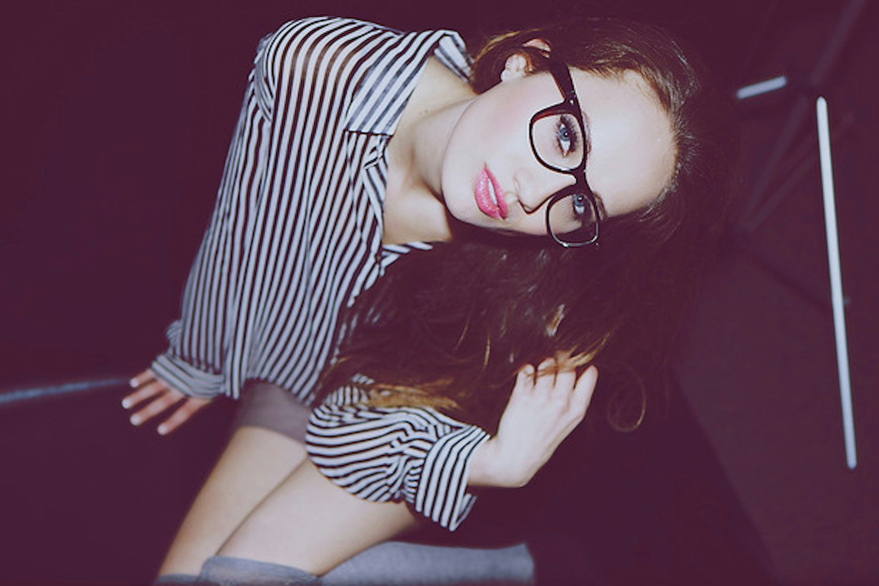 a woman wearing glasses