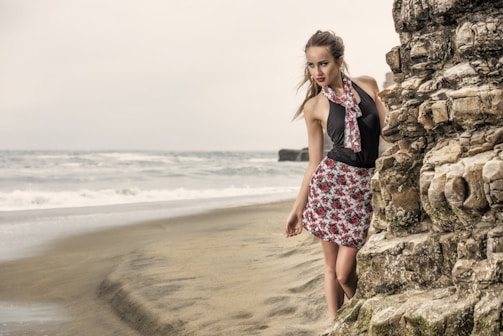 a woman standing on a beach