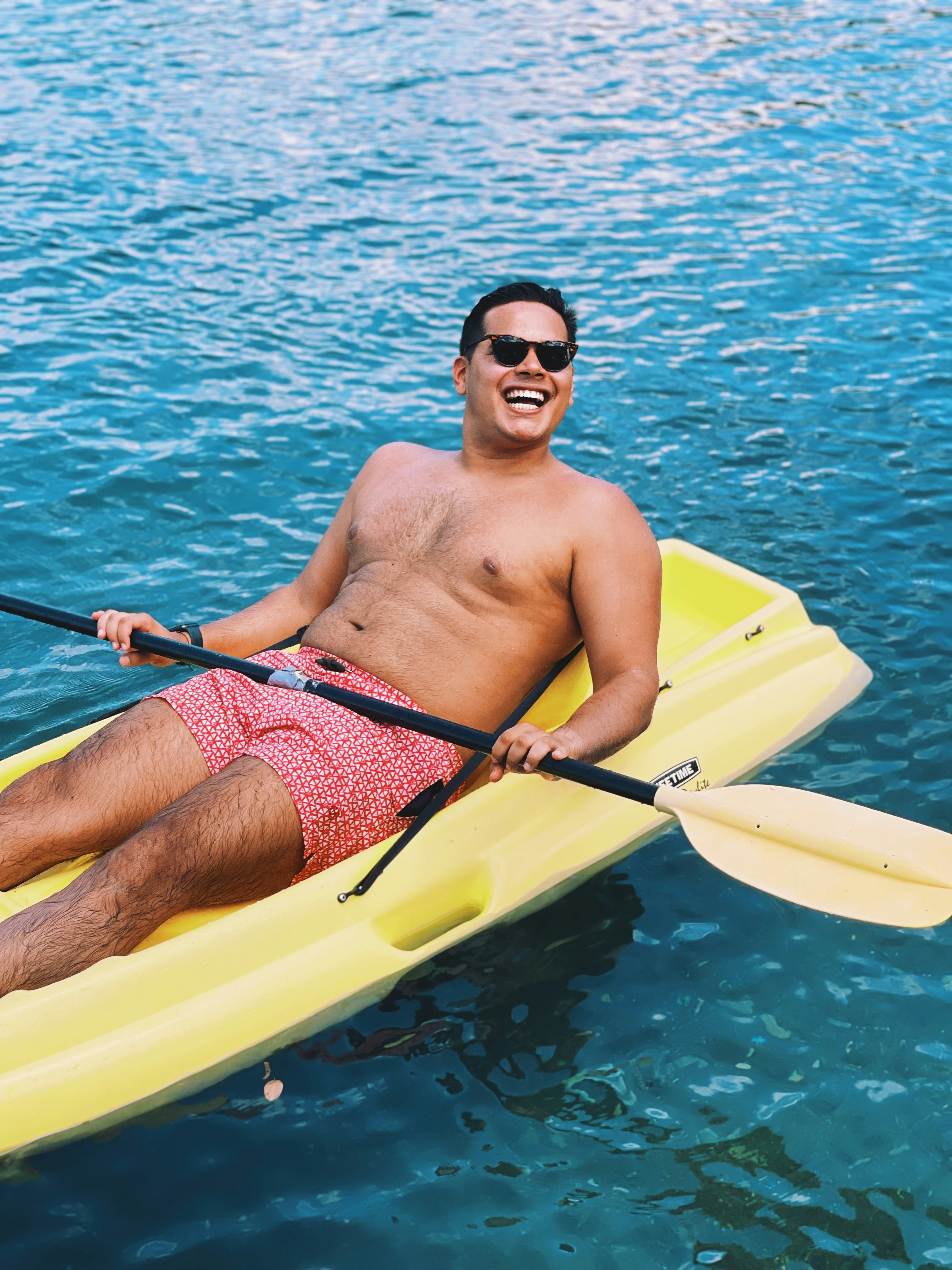 a person in a yellow kayak