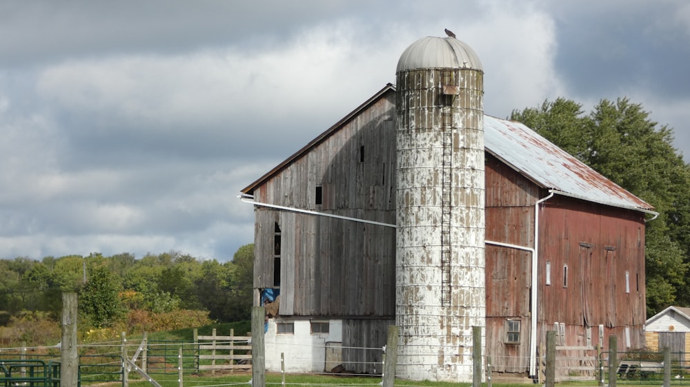 a barn with a silo