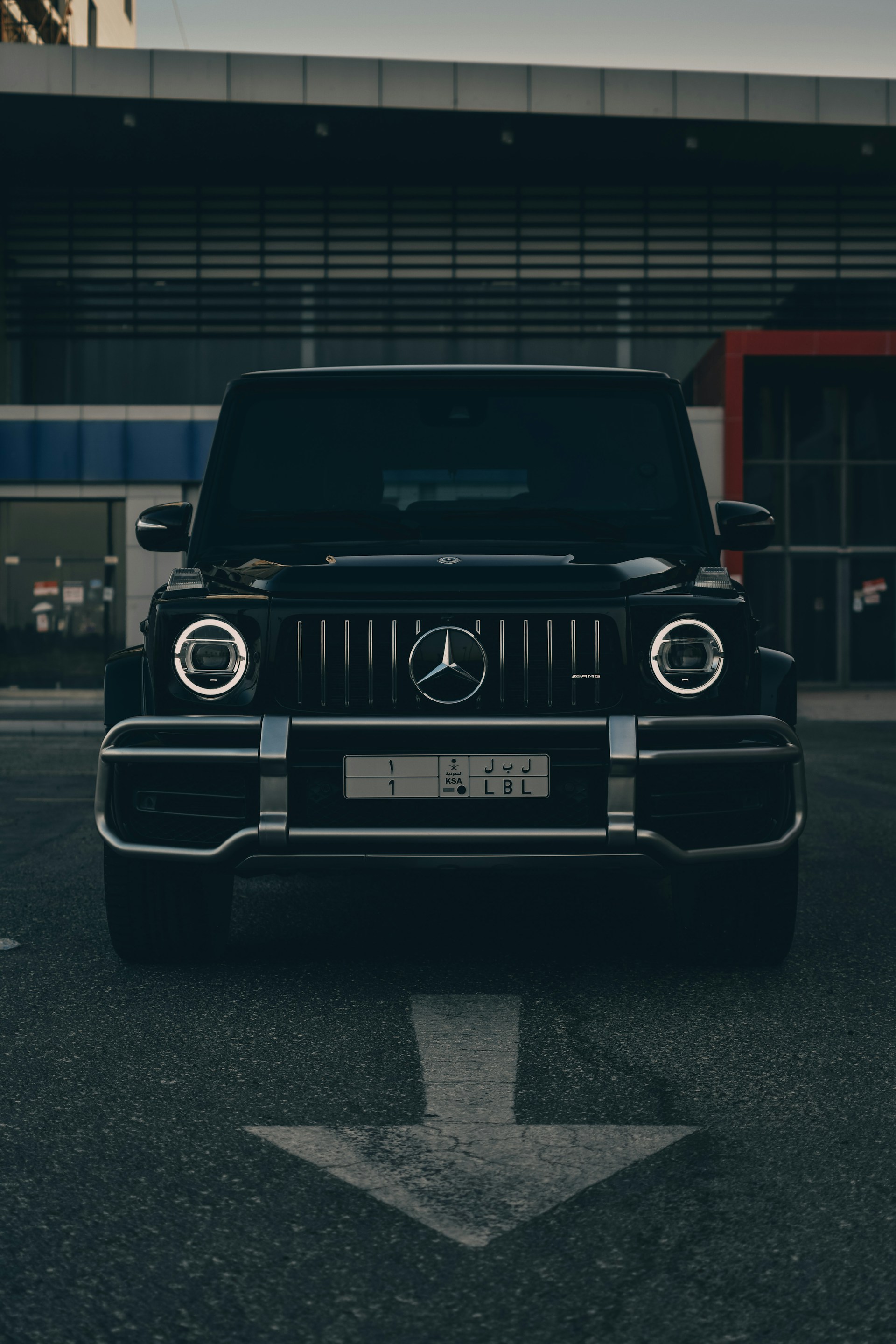 a black car parked in a parking lot