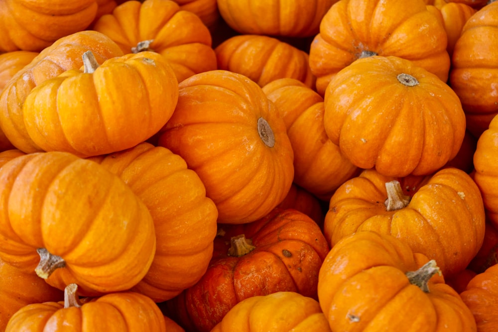 a pile of orange pumpkins