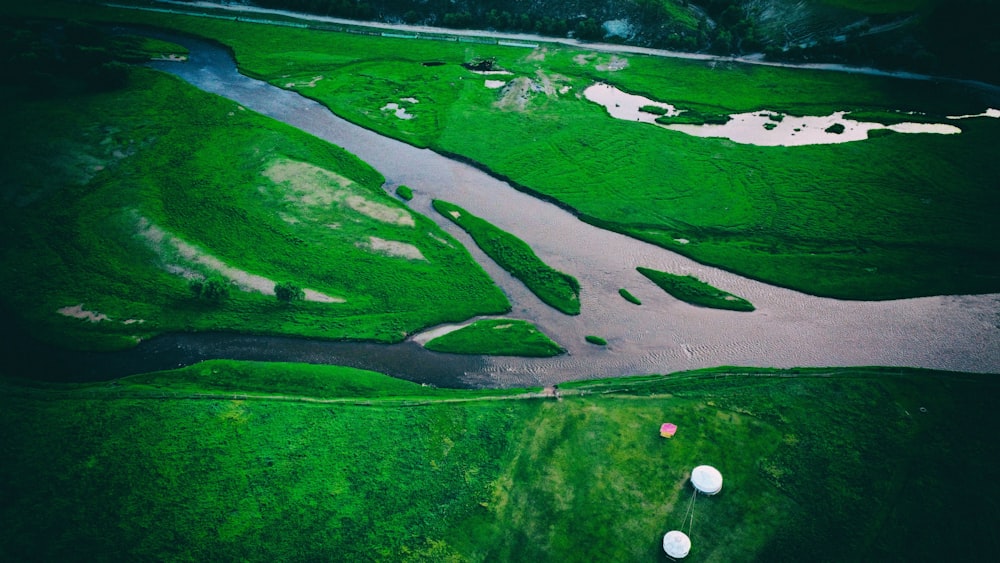 a river with green land