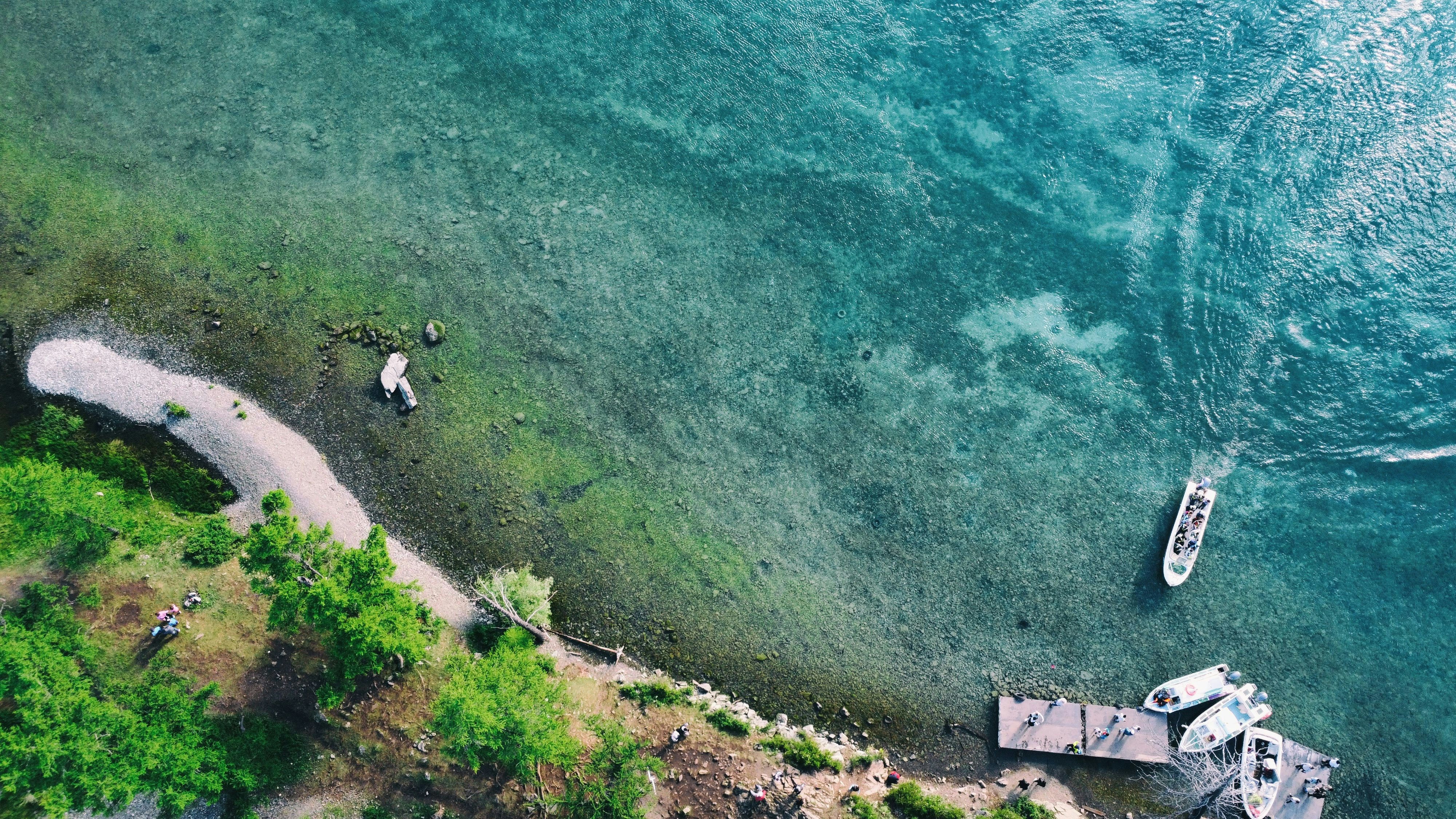 a group of boats on a river, Khuvsgul Lake