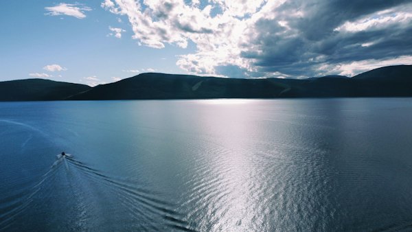 A body of water with mountains in the background — Lake Khövsgöl, Mongolia
