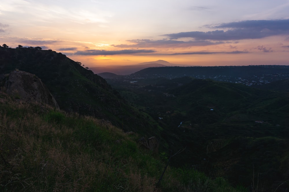 a landscape with hills and grass