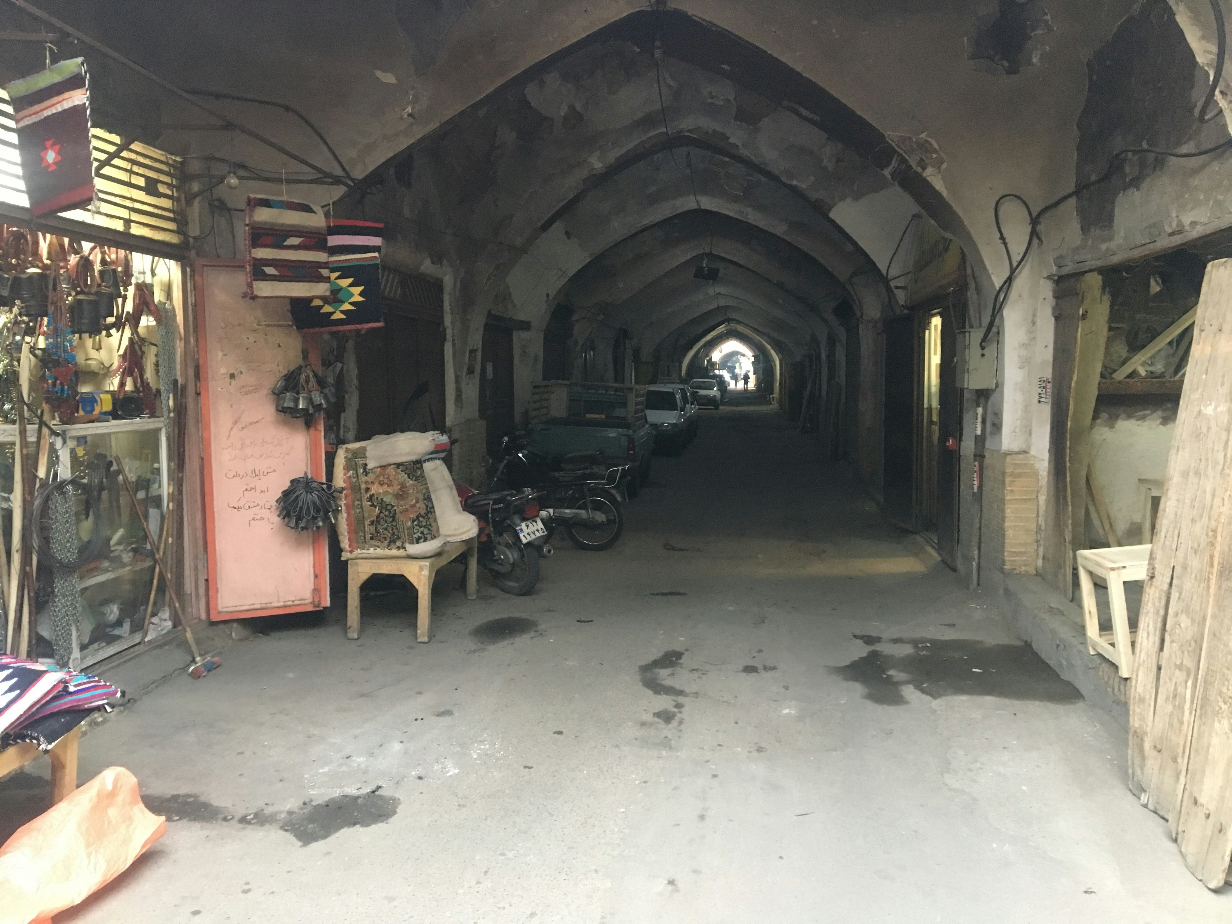 a room with a chair and motorcycles