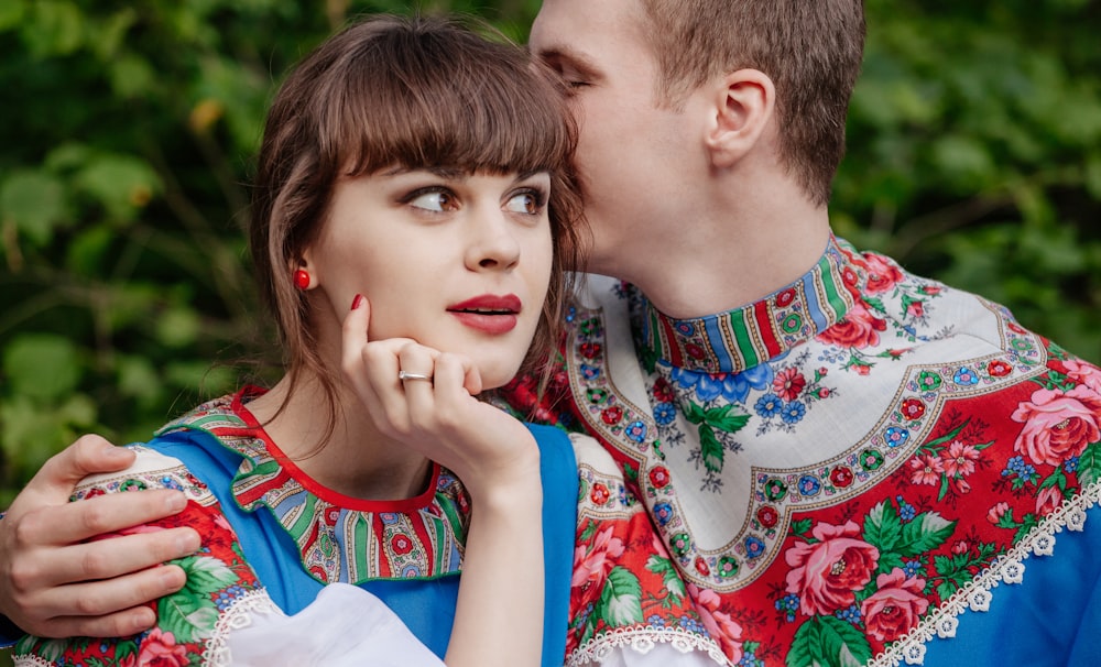 a man kissing a woman