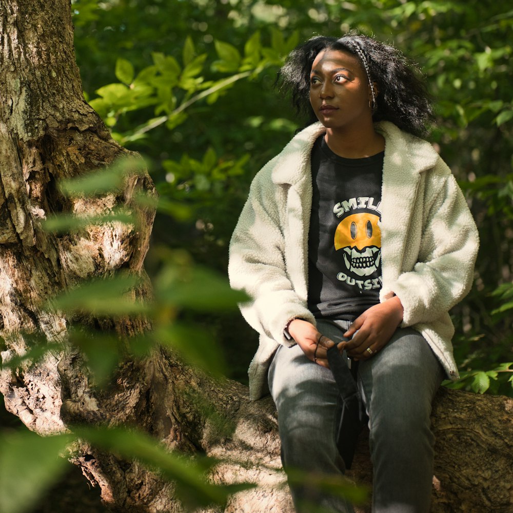 a person sitting on a rock