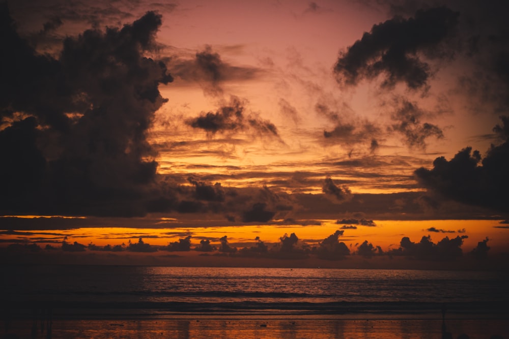 a sunset over a body of water