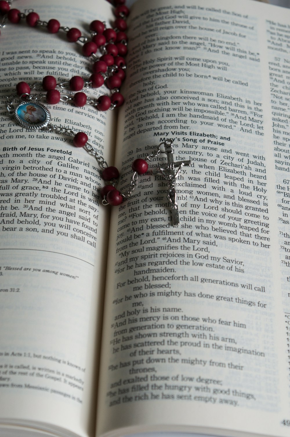 a book open with a necklace on it