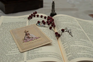 a book and a necklace on a table