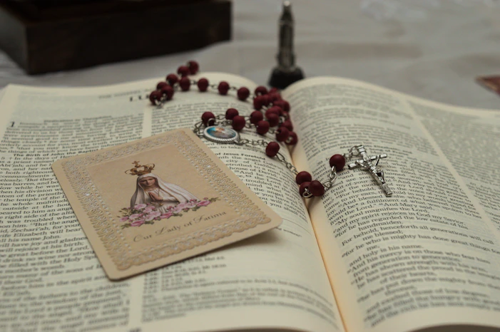 a book and a necklace on a table