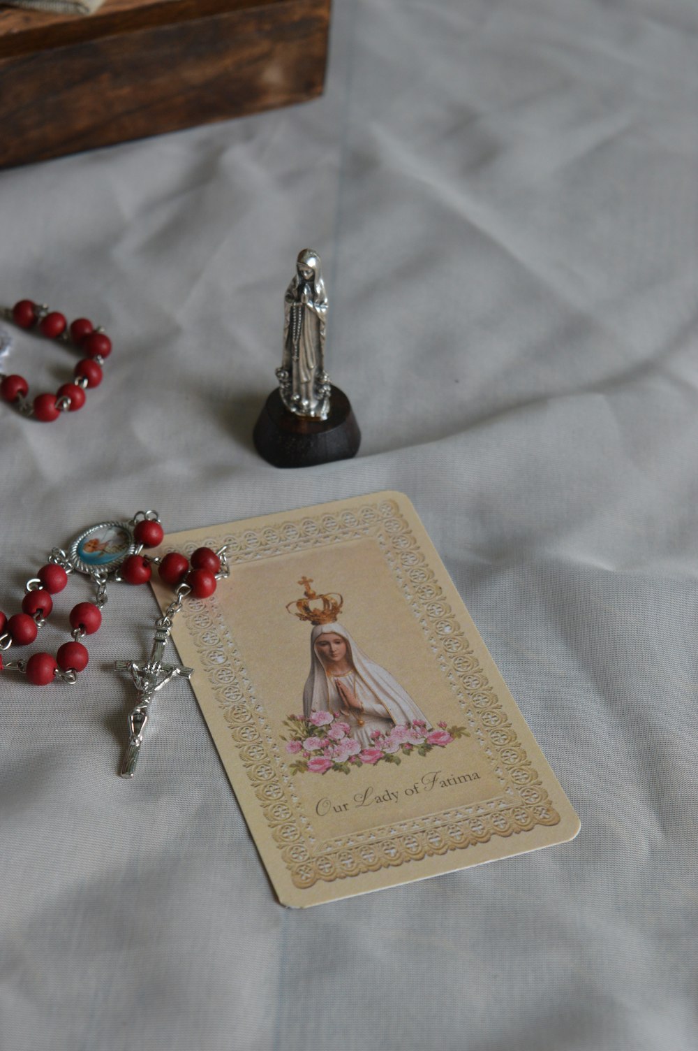 a necklace and a picture on a table