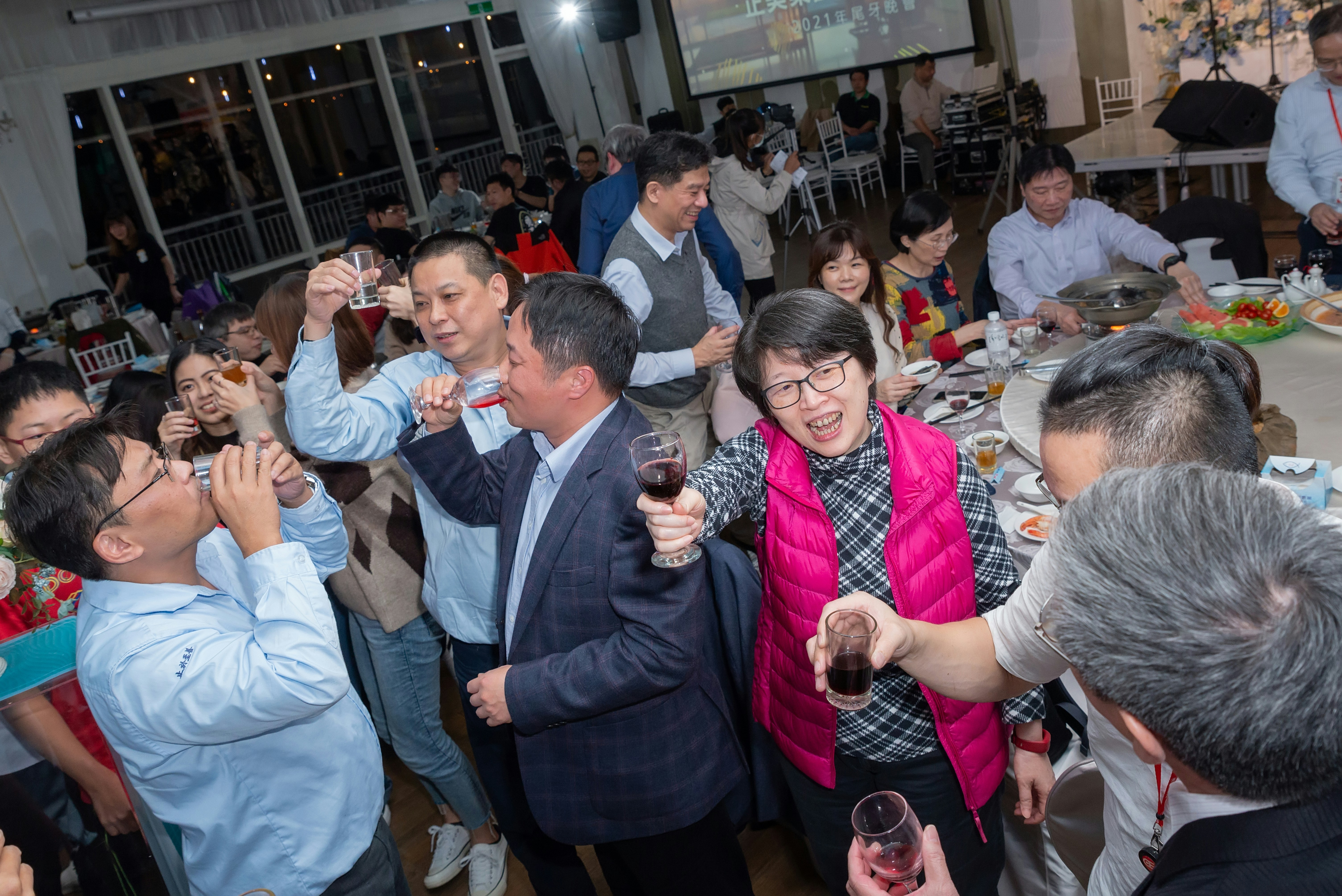 People enjoying drinks together at a lively Calgary gathering