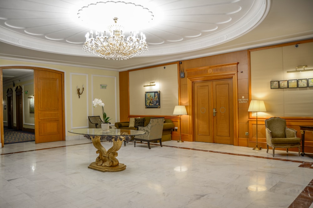 a large room with a chandelier and chairs