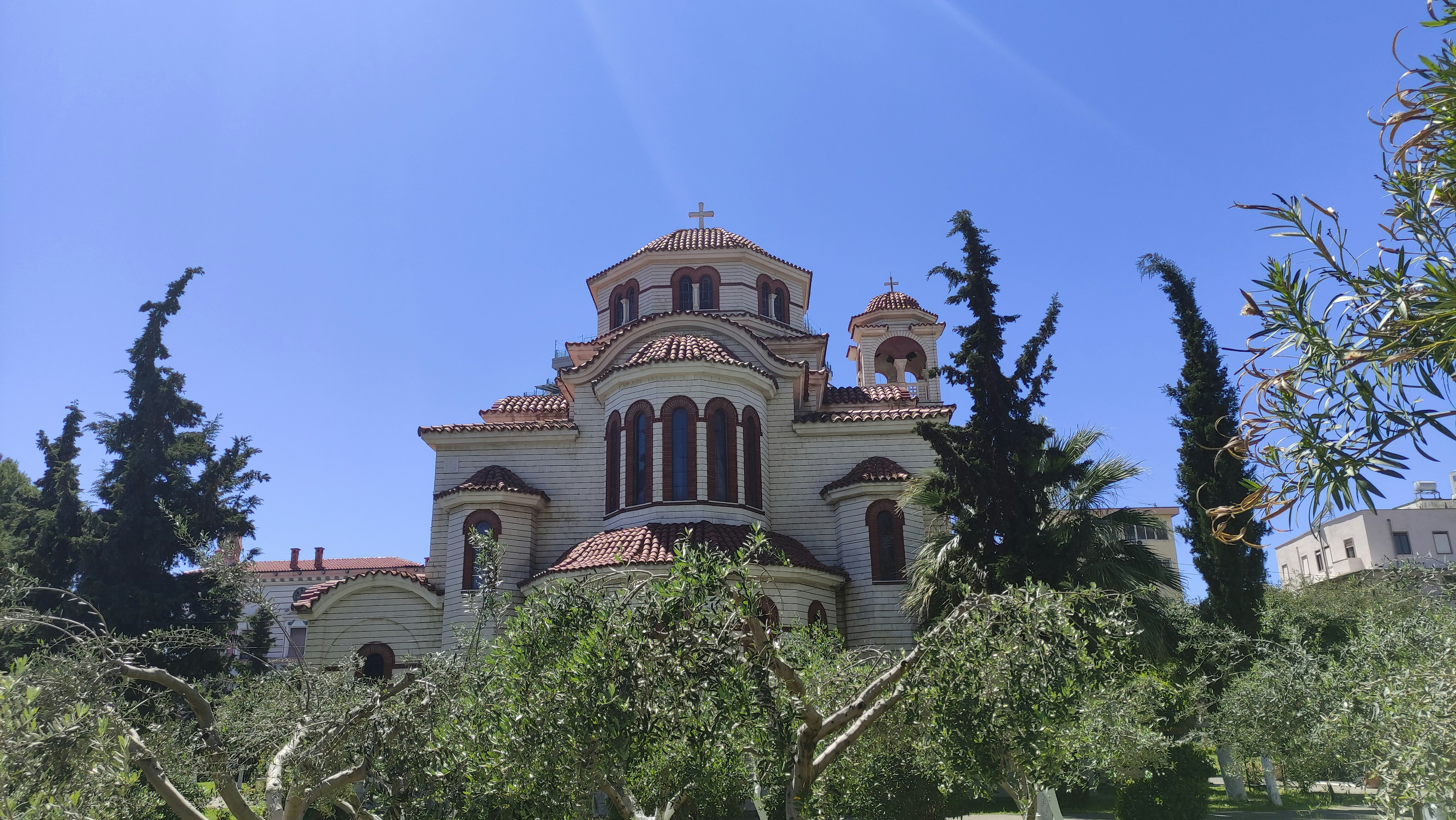 a building with trees around it, 