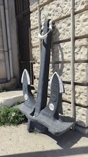 Close-up of a rock anchor embedded in rocky terrain, showcasing solid construction.