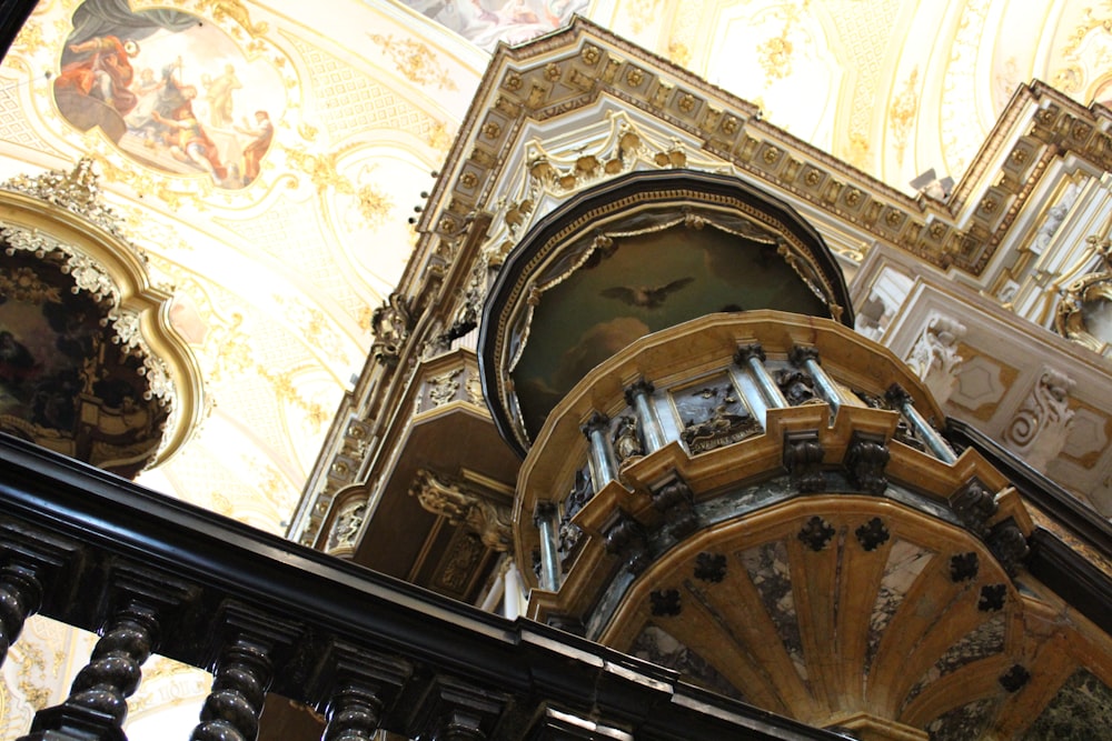 a large ornate ceiling with paintings