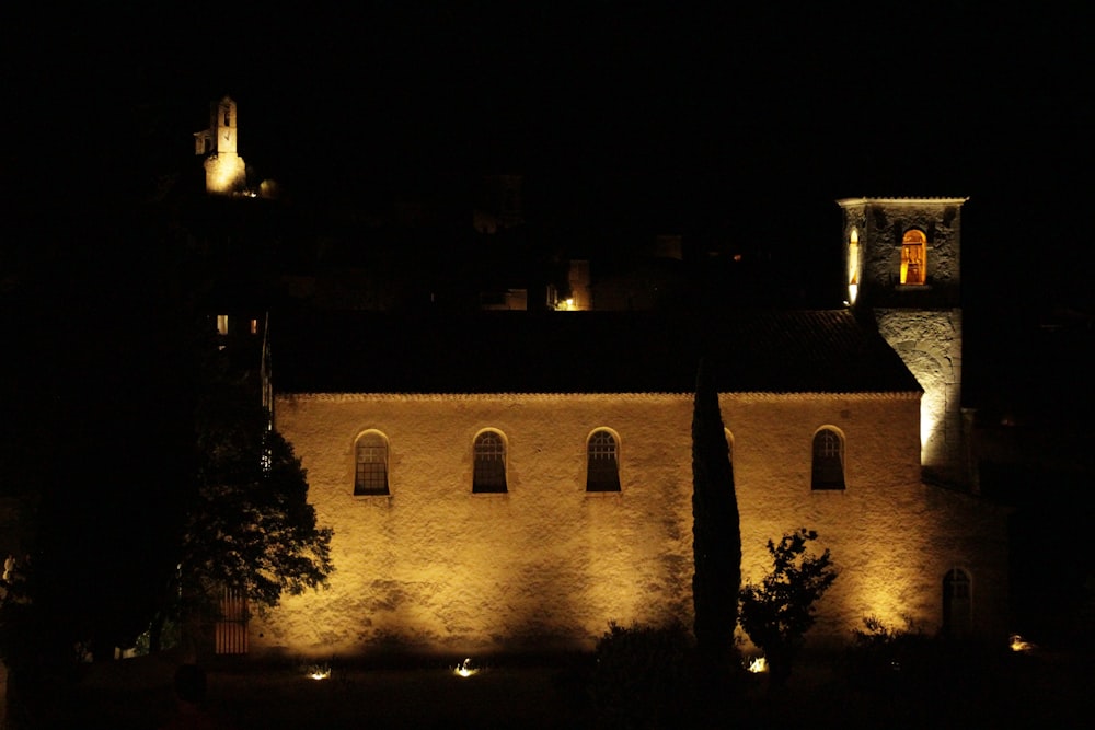 a castle lit up at night