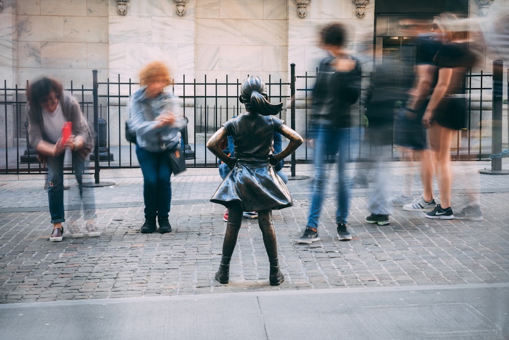 a person in a garment walking on a sidewalk