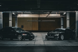 two cars parked in a parking garage