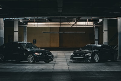 two cars parked in a parking garage