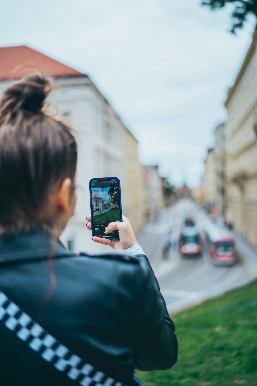 a person taking a picture of a street