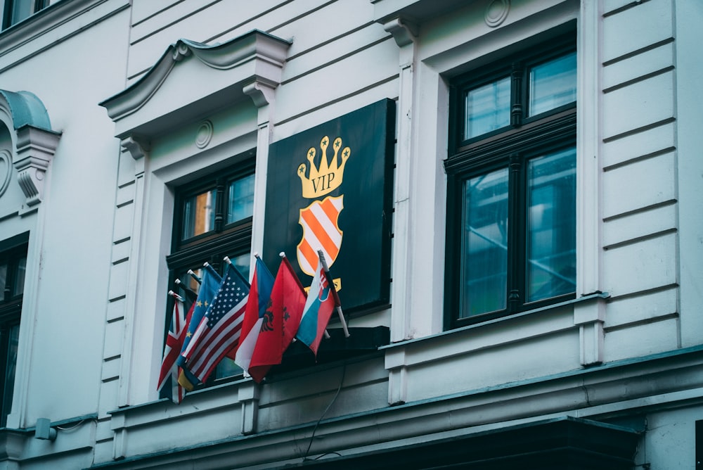 a group of flags on a building
