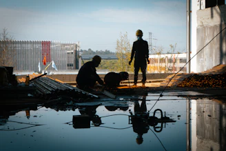 a few men working on a building