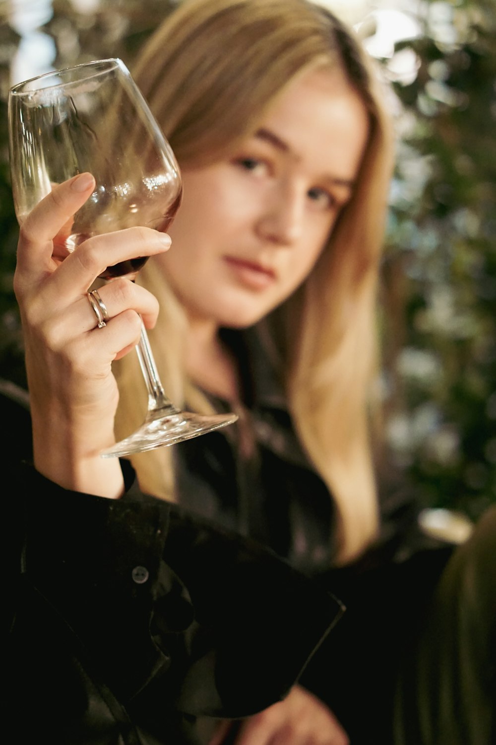 a woman holding a wine glass