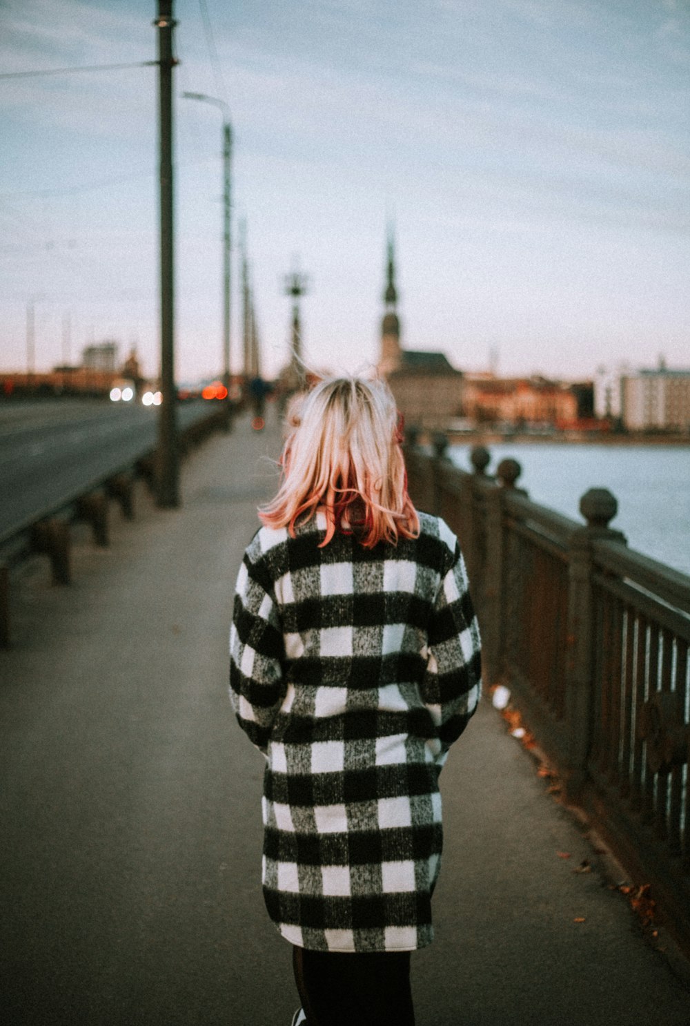 a person standing on a bridge