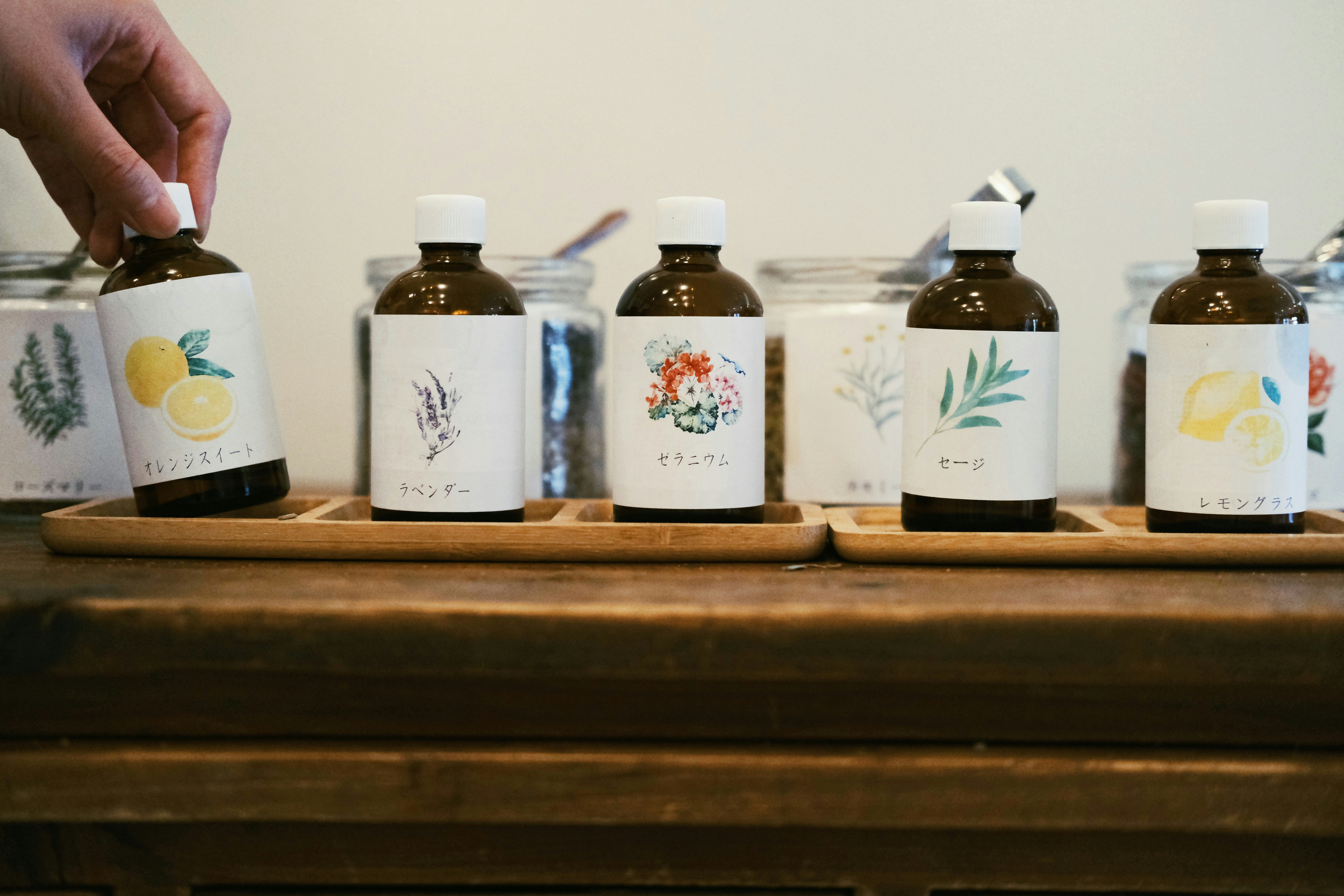 a hand holding a bottle of liquor