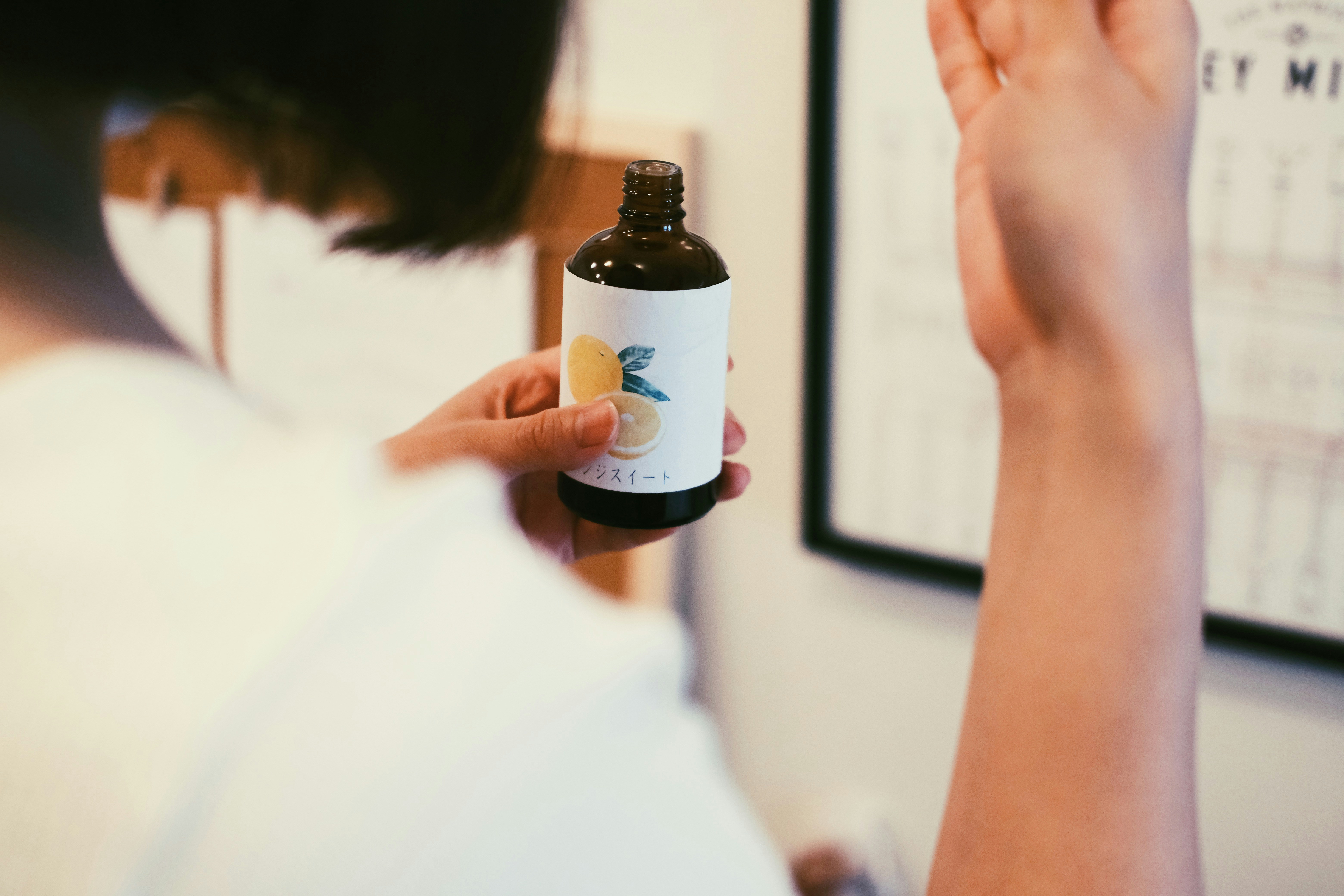 a person holding a bottle