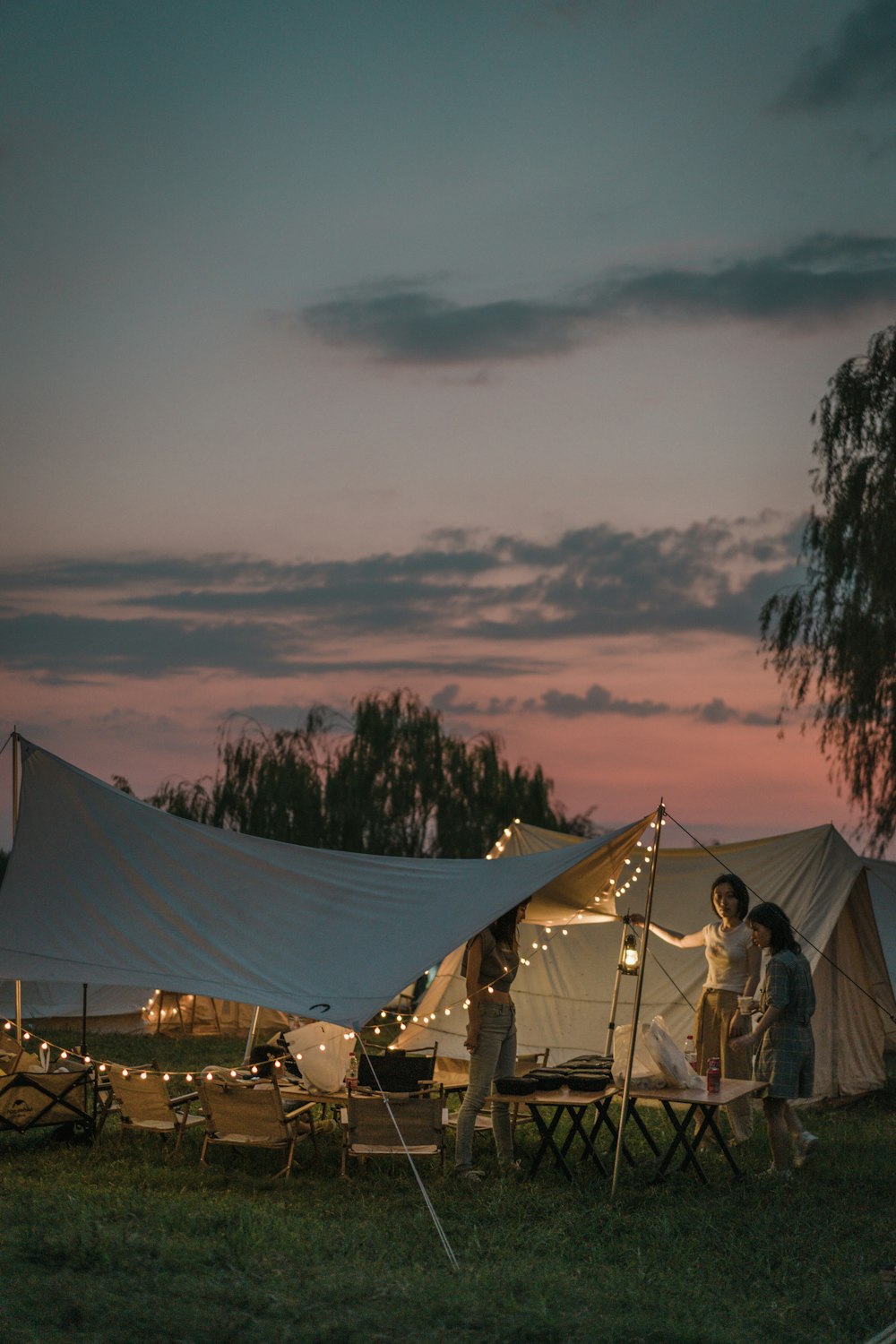 a group of people outside of a tent