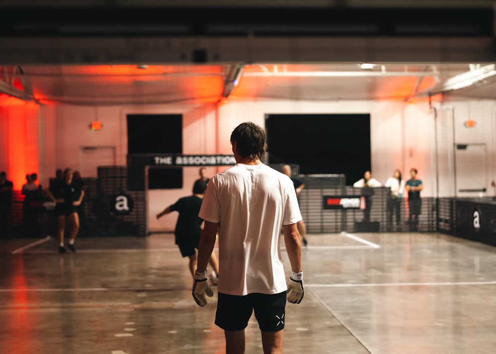 a person walking on a basketball court