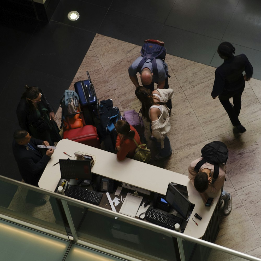 people with luggage on the floor