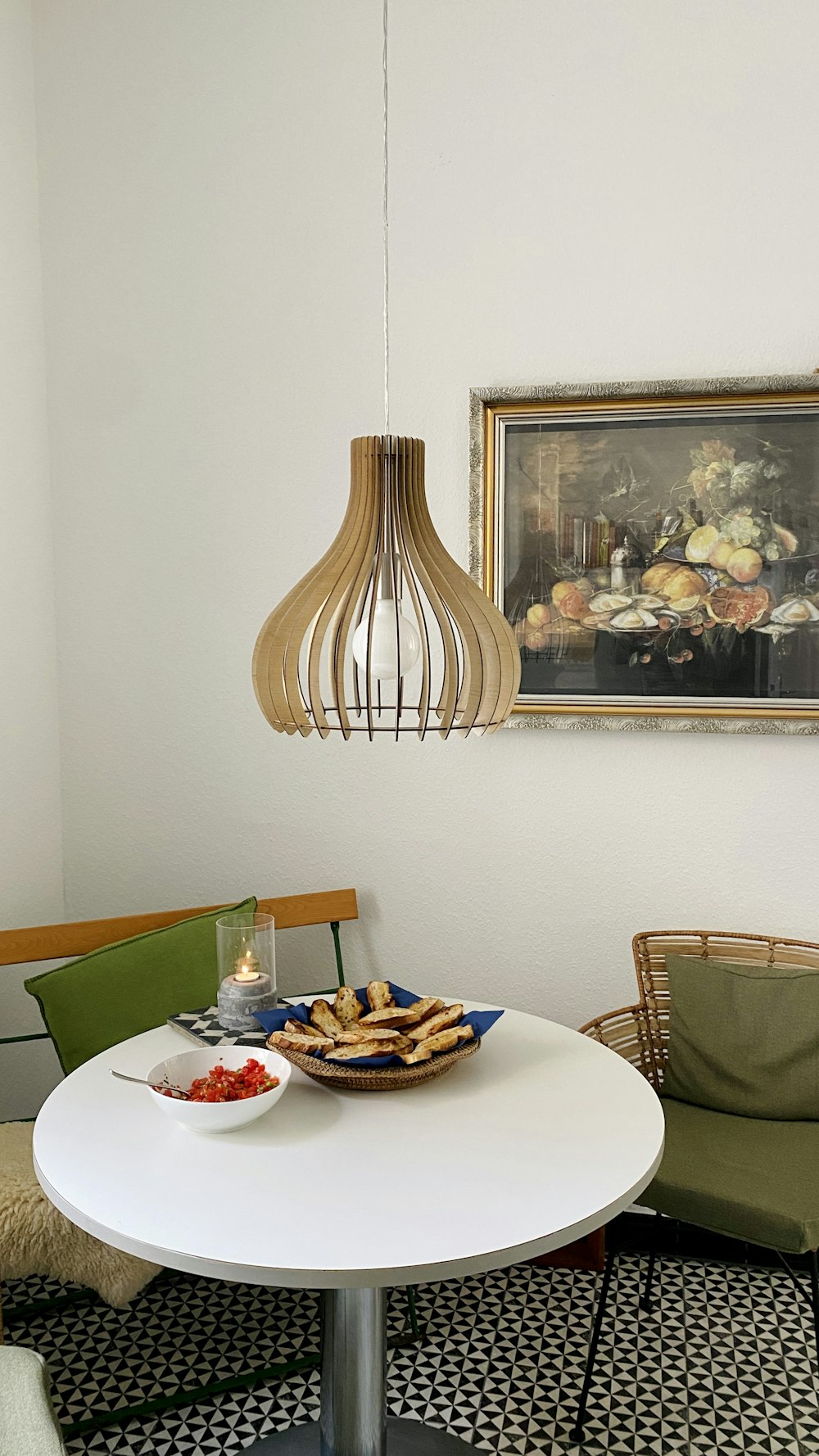 a table with a bowl of food and a lamp on it