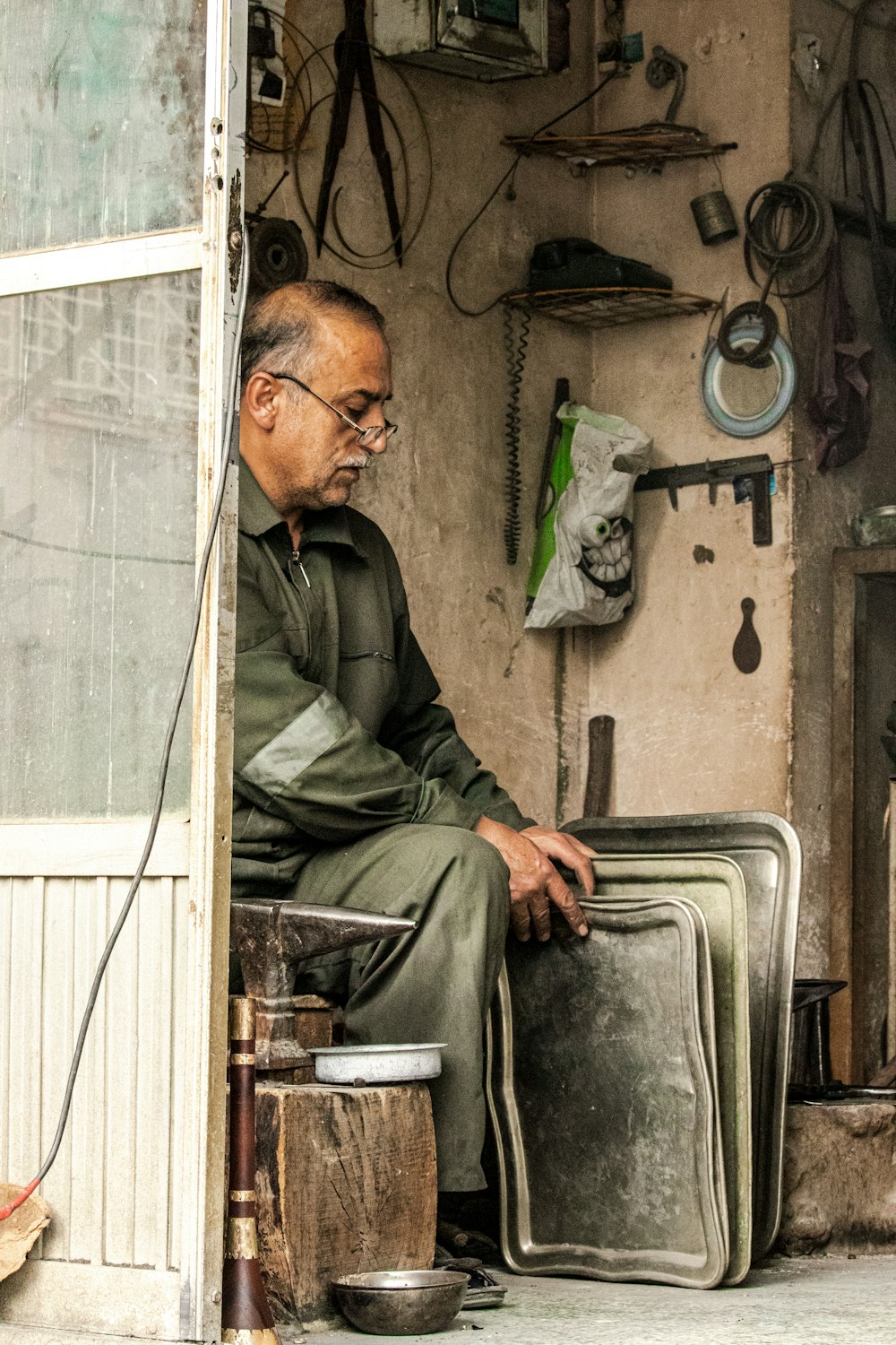 a man sitting on a stool