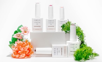 a group of bottles and flowers