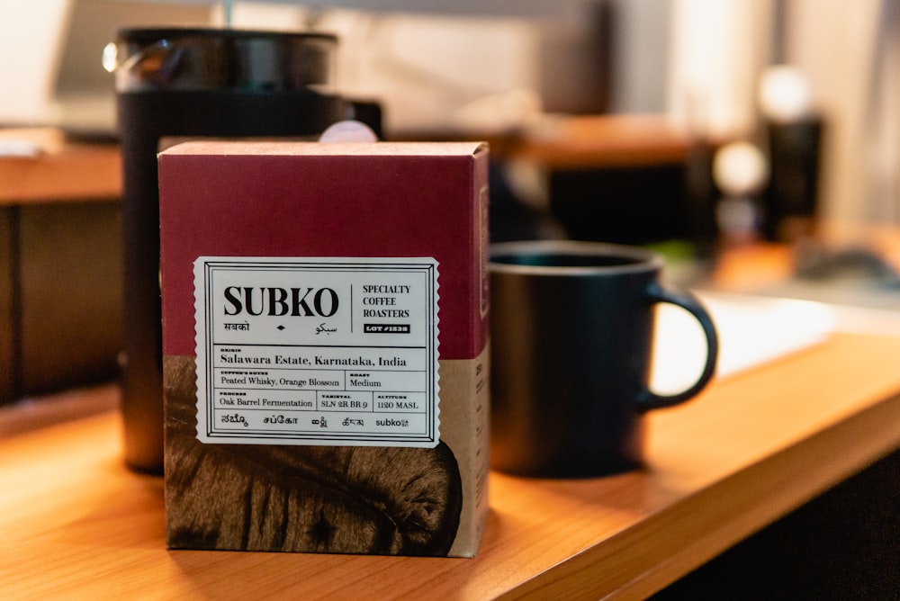 a mug and a box on a table